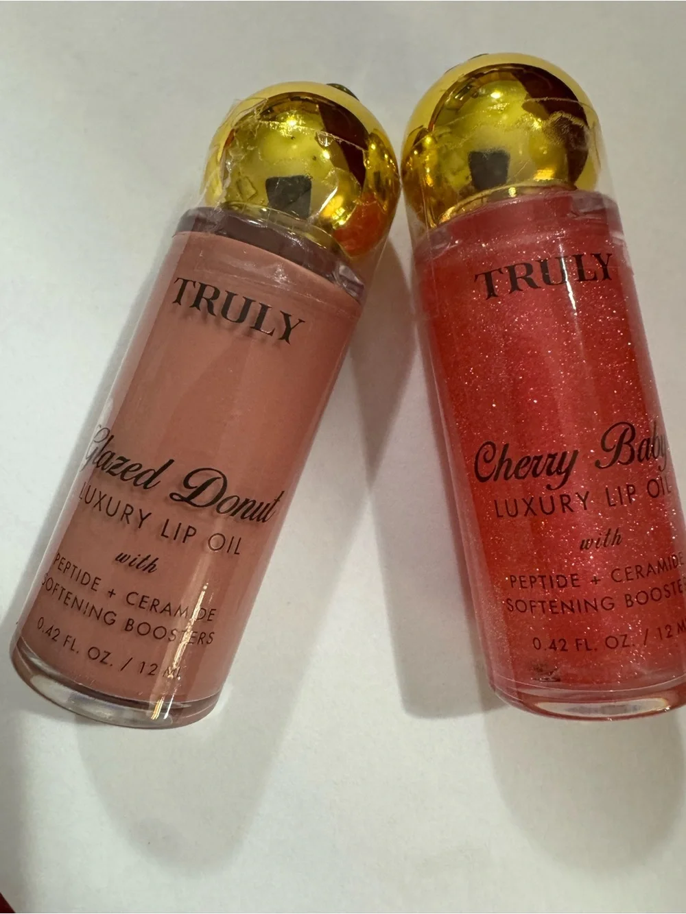 TRULY Cherry Baby & Glazed Donut Lip Oil Duo - Sparkling Pink & Nude Beige